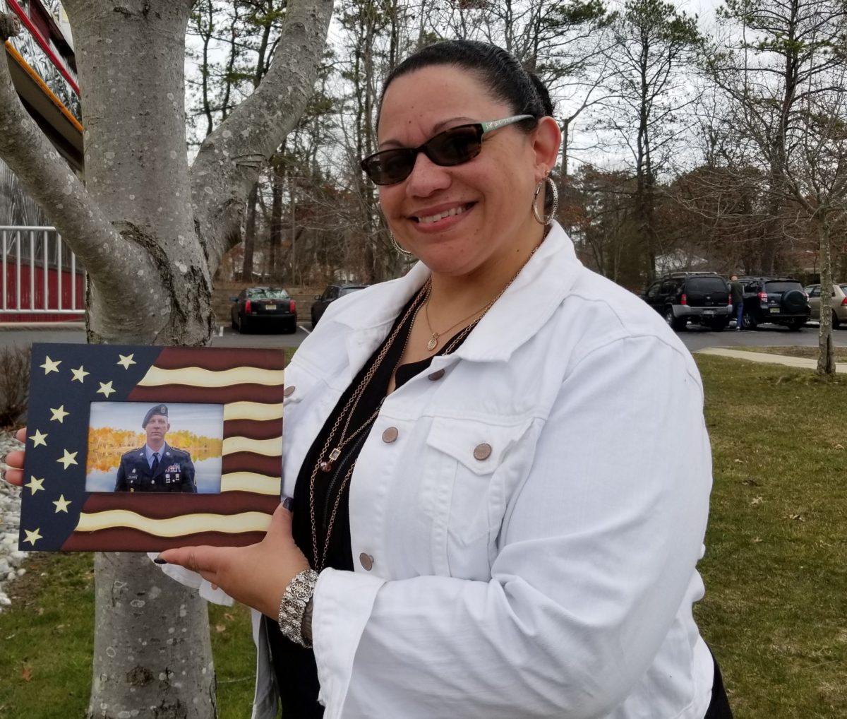 Michelle Gallagher with her husband Timothy's photo.