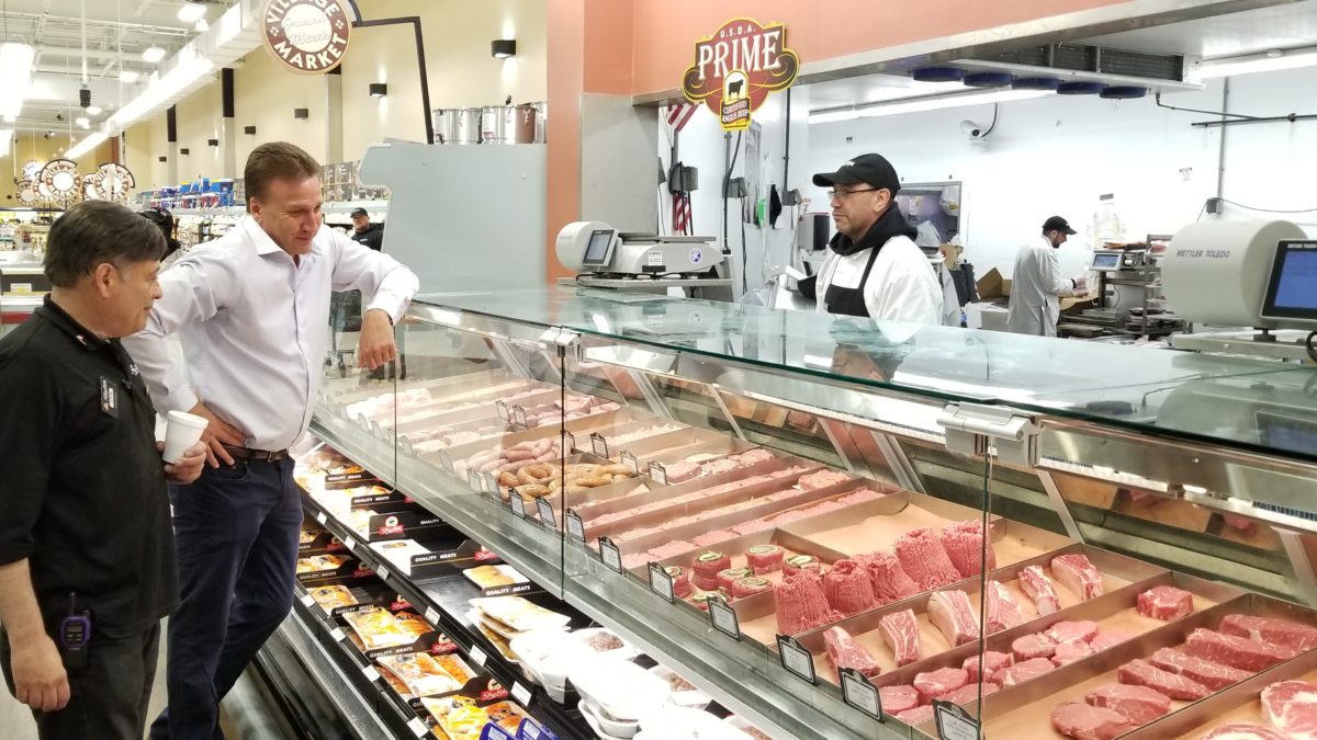 President Brian String visiting a Village Supermarket.