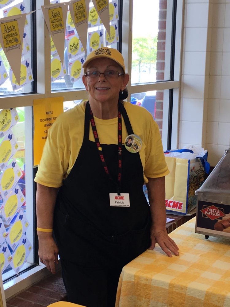 Patti O'Neill in front of the Alex's Lemonade Stand.