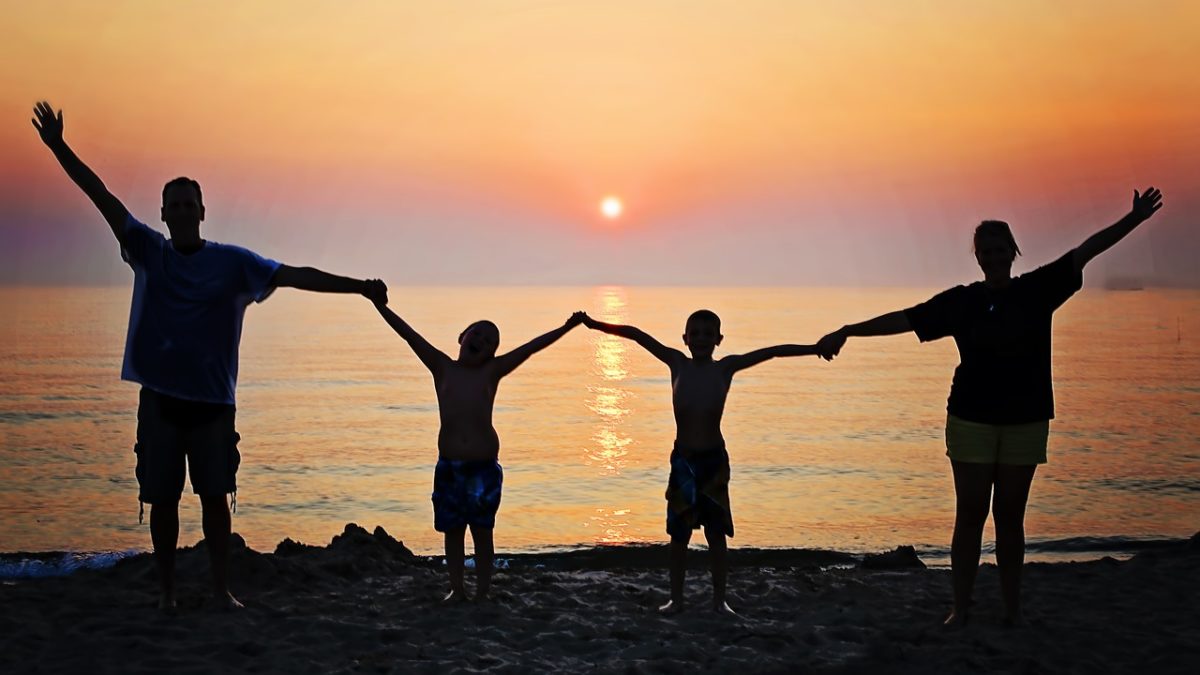A family enjoying a sunset