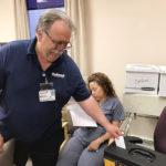 A UFCW Local 152 member voting at Bacharach's ratification meeting.