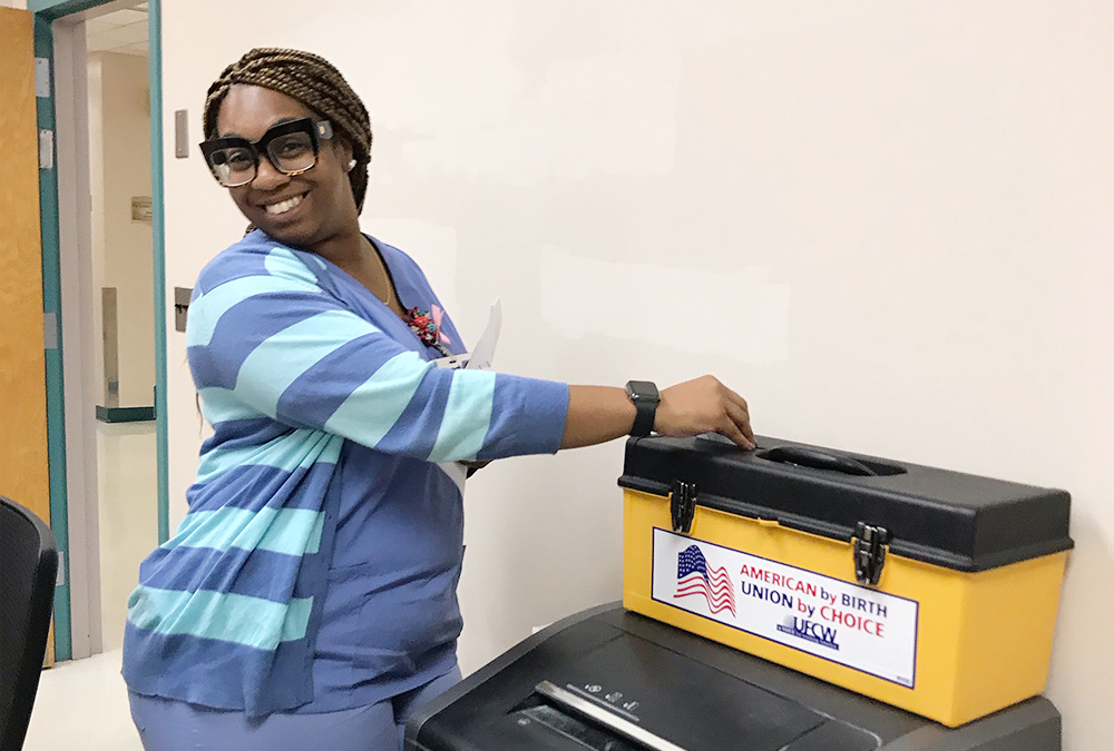 A UFCW Local 152 member voting at Bacharach's ratification meeting.