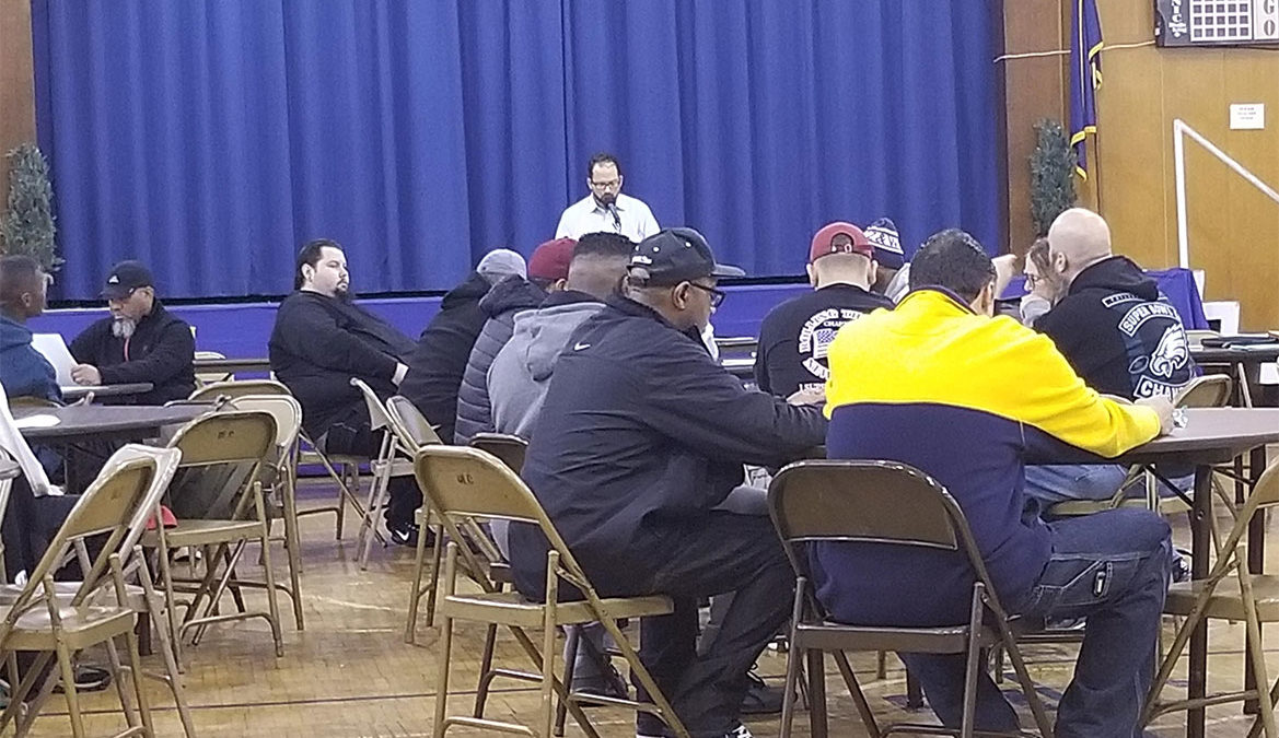 Members of Dietz and Watson Logistics learning about the new contract to vote.
