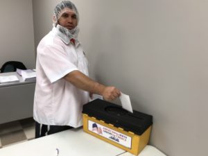A TQ Baking member casting a vote at the contract ratification meeting on 10/23/2019.