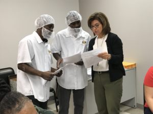 Members of TQ Baking learning what the contract is about.