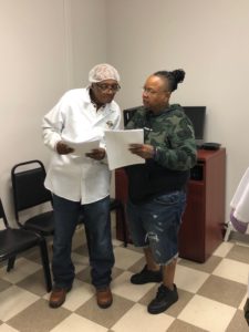 Members of TQ Baking learning what the contract is about.