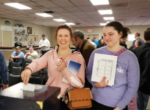 An Acme Markets member voting on the proposed contract.