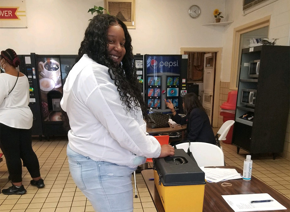 Tyshika Hayes, a member at Hanover Foods in Clayton, DE voting at the contract ratification meeting.