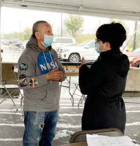A member with Executive Director Danette Montes-Palmore the Goya Foods ratification, 10/12/2020