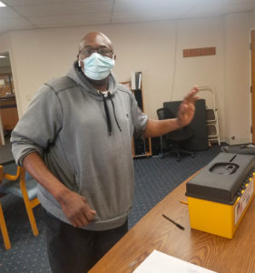 A member from Southgate Health Care Center voting at the ratification on 3/4/2021.