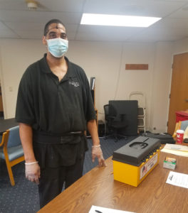 A member from Southgate Health Care Center voting at the ratification on 3/4/2021.
