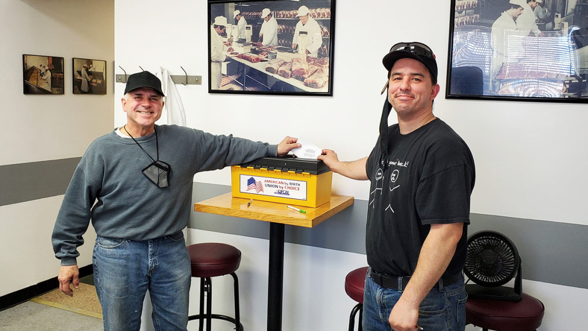 Committee member David Pecunia and Shop Steward Anthony Ditheodore voting at the George Wells Meat Co ratification meeting on May 12, 2021.