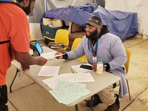 Steward Antonio Fontanez and Committee member Tuon Tran tallying ballots.