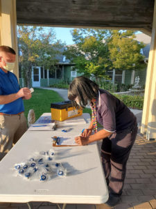 A member voting at the Victoria Commons ratification meeting, 2021.