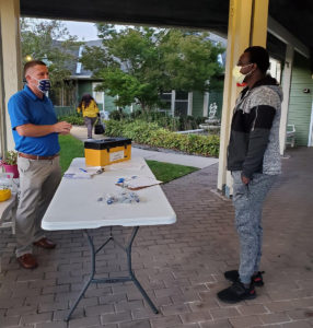 A member voting at the Victoria Commons ratification meeting, 2021.