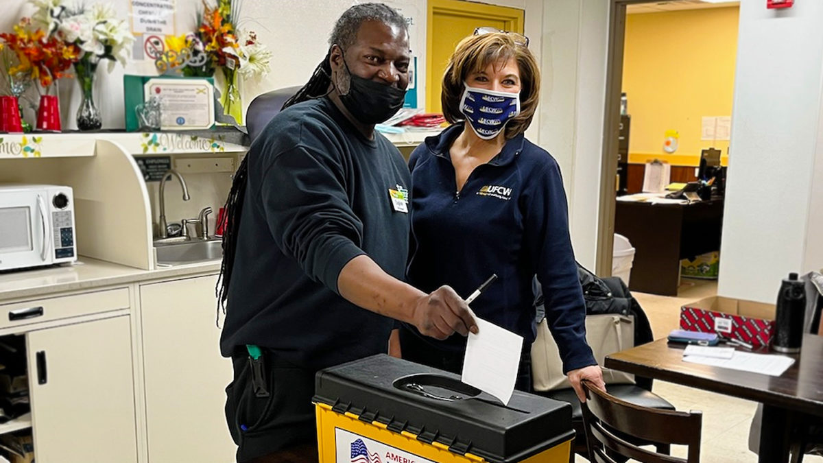 Assistant Director of Collective Bargaining Lisa Sanders with Local 152 member English as he casts his vote on 2/2/2022.