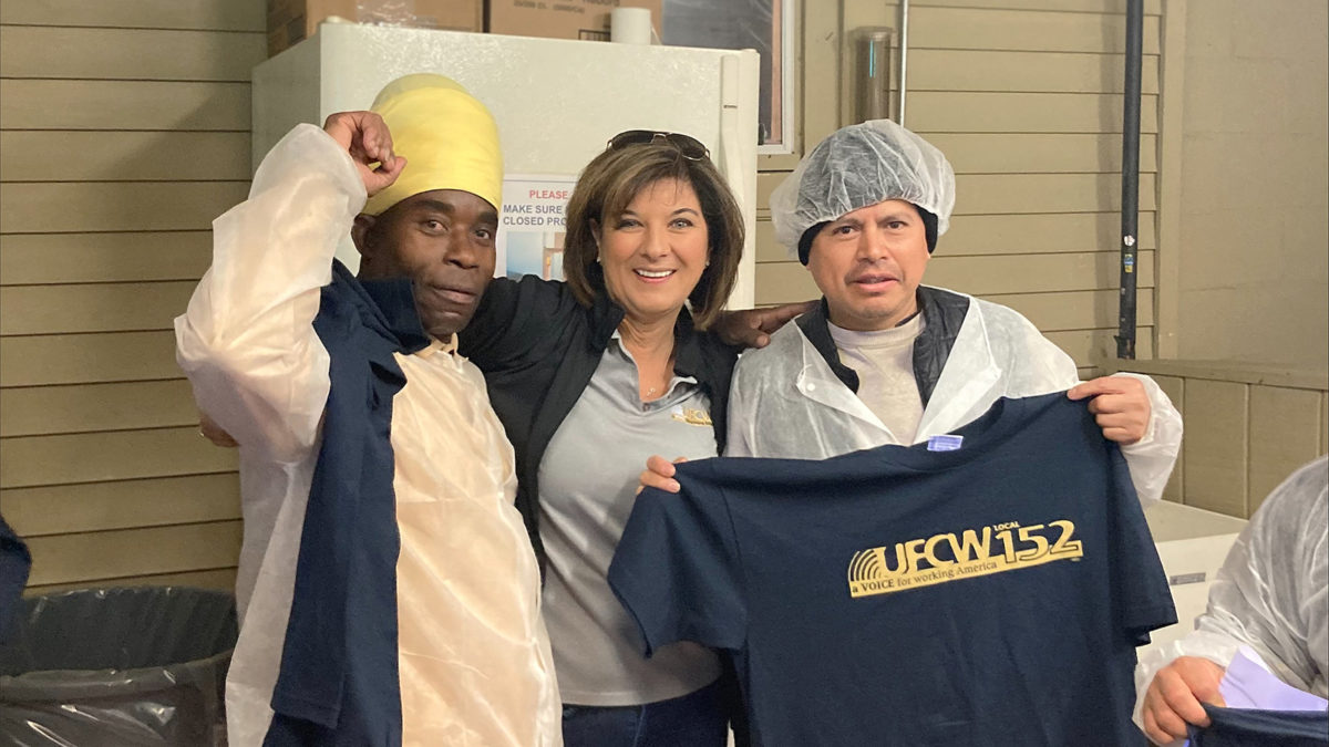 Assistant Director of Collective Bargaining Lisa Sanders with Shop Steward James Grant and another member at the Case's Pork Roll ratification meeting on 4/28/22.
