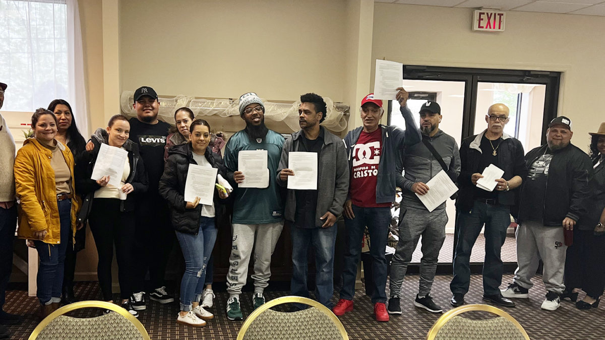Members of Rich Foods cheering for their new contract!