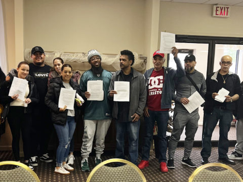 Members of Rich Foods cheering for their new contract!