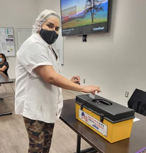 A member voting at the ratification meeting on 11/16/2022.
