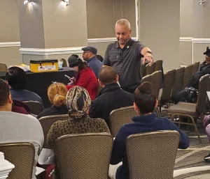 Union Representative Jose Echevarria explaining the proposed contract at the ratification meeting, 2022.