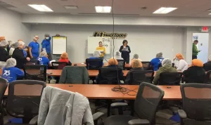 Assistant Director of Field Services Lisa Sanders explaining the proposed contract at the ratification meeting, 2022.